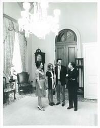 ["Black and white photograph print of Carl Albert in various poses with unidentified people."]