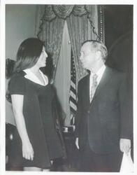 ["Black and white photograph print of Carl Albert in various poses with unidentified people."]