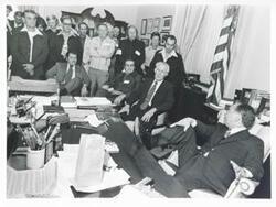 ["Black and white photograph print of Carl Albert in various poses with unidentified people."]