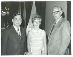 ["Black and white photograph print of Carl Albert standing with Mr. and Mrs. H.E. Daniel during their visit to Washington, D.C. August 4, 1971"]