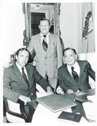 ["Black and white photograph print of Carl Albert with two unidentified men."]