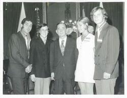 ["Black and white photograph print of Carl Albert standing with the Washington Workshop Students-Paul George, Mark Shiffrin, Mary Bucaro, and Steve Foster. August 3, 1971"]