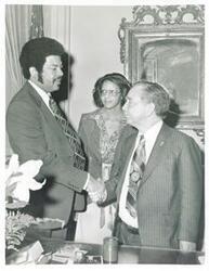 ["Black and white photograph print of Henry Butler, Loise Butler, and Carl Albert. October 28, 1975"]