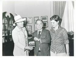 ["Black and white photograph print of Carl Albert standing with Ruth Sheldon Knowles, author of America's Oil Famine, and Caroll-Lois Knowles. May 23, 1975"]