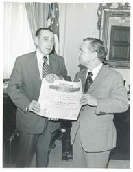 ["Black and white photograph print of Carl Albert standing with Lewis Barton, Department of Labor. June 13, 1974"]