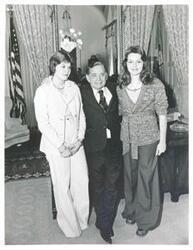 ["Black and white photograph print of Carl Albert posing with Rosemary and Janet Russell."]
