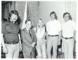 ["Black and white photograph print of Carl Albert with Susan Ford and unidentified people."]