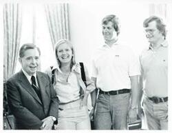["Black and white photograph print of Carl Albert standing with Susan Ford and two unidentified men."]