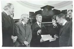 ["Black and white photograph print of Hubert H. Humphrey, Mark Hatfield, Lindy Boggs, Carl Albert and others at the Centennial Safe Opening ceremony."]
