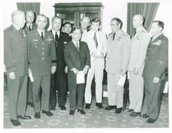 ["Black and white photograph print of Carl Albert standing with William Westmoreland, Jack Kemp, Elmo Zumwalt, and others at Flag Day ceremonies. June 14, 1971"]