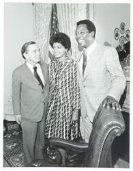 ["Black and white photograph print of Carl Albert posing with Hank Aaron and his wife."]