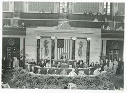 ["Black and white photograph print of larger photo of Carl Albert, Barbara Jordan, and Alistaire Cooke with others at the First Continental Congress. September 25, 1974"]