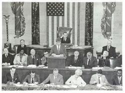 ["Black and white photograph print of Jack Kemp speaking at the anniversary of the First Continental Congress. Also show in Carl Albert, Alistaire Cook, and Barbara Jordan. September 25, 1974"]