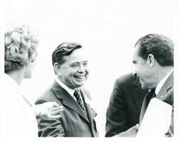 ["Black and white photograph print of Pat Nixon, Carl Albert, and Richard M. Nixon at the Lyndon B. Johnson library dedication."]