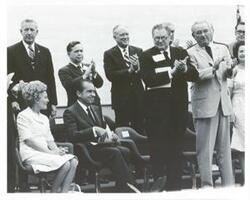 ["Black and white photograph print of Pat Nixon, Richard M. Nixon, Carl Albert, John B. Connally, Lyndon B. Johnson, Lady Bird Johnson and others at the LBJ library dedication."]