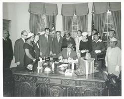 ["Black and white photograph print of John F. Kennedy signing S. 2399, An Act to provide for the establishment of the Frederick Douglas home as a part of the park system in the National Capital"]