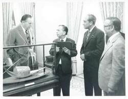 ["Black and white photograph print of Carl Albert, Thomas E. Morgan, and other men during the Bangladesh trip. July 1, 1976"]