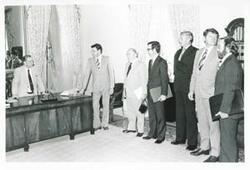["Black and white photograph print of Carl Albert and several unidentified men in Albert's office."]