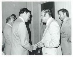 ["Black and white photograph print of unidentified men."]