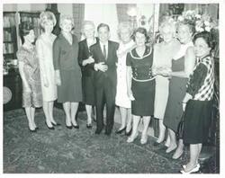 ["Black and white photograph print of Mary Albert, Helen Newman Tuttle, Mrs. Gene Penix, Mrs. W.E. McGowan, Carl Albert, Mrs. Hubert H. Humphrey, Mrs. Fowla Cochran, Julia Butler Hansen, Leonor Sullivan, and Patsy Mink posing for a picture. May 16, 1967"]