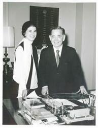 ["Black and white photograph print of Carl Albert posing with unidentified people."]