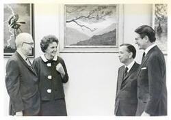 ["Black and white photograph print of Tom Steed, Carl Albert and Eliot Richardson, speaking with an unidentified woman."]