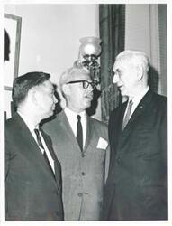 ["Black and white photograph print of Carl Albert speaking with Arthur Goldberg and John W. McCormack."]