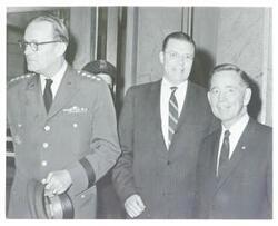["Black and white photograph print of Carl Albert posing with Robert S. McNamara and an unidentified man."]