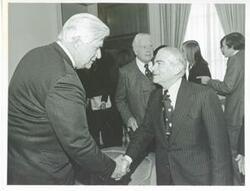 ["Black and white photograph print of Thomas P. O'Neill shaking hands with the Honorable Abraham Beame, mayor of New York City. March 1974"]