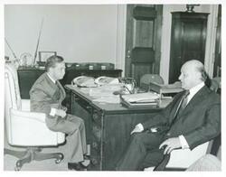 ["Black and white photograph print of Carl Albert posing with four unidentified people."]