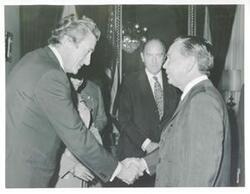 ["Black and white photograph print of Carl Albert with unidentified men."]