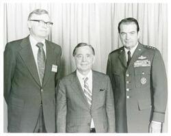 ["Black and white photograph print of Carl Albert posing with John J. Henry and General David Jones, Air Force Chief of Staff. September 17, 1975"]