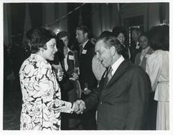 ["Black and white photograph print of Carl Albert with various unidentified people during his birthday, 1976"]