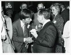 ["Black and white photograph print of Carl Albert with various unidentified people during his birthday, 1976"]