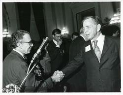 ["Black and white photograph print of Carl Albert with various unidentified people at his birthday party, 1976"]