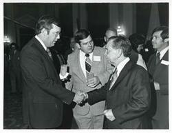 ["Black and white photograph print of Carl Albert with various unidentified people at his birthday party, 1976"]