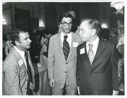 ["Black and white photograph print of Carl Albert standing with Joel Jankowsky and another man at his birthday party, 1976"]