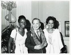 ["Black and white photograph print of Carl Albert with unidentified people at his birthday party, 1976"]
