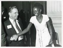 ["Black and white photograph print of Carl Albert with unidentified people at his birthday party, 1976"]