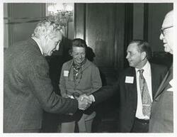 ["Black and white photograph print of Carl Albert with unidentified people at his birthday party, 1976"]