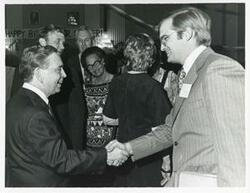 ["Black and white photograph print of Carl Albert with various unidentified people at his birthday party, 1976"]