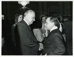 ["Black and white photograph print of Carl Albert with various unidentified people at his birthday party, 1976"]