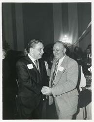 ["Black and white photograph print of Carl Albert with various unidentified people at his birthday party, 1976"]