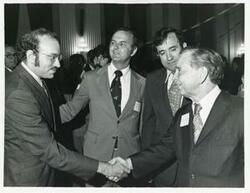 ["Black and white photograph print of Carl Albert with various unidentified people at his birthday party, 1976"]