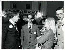 ["Black and white photograph print of Carl Albert with unidentified people at his birthday party, 1976"]