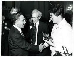 ["Black and white photograph print of Carl Albert with unidentified people at his birthday party, 1976"]