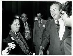 ["Black and white photograph print of Carl Albert with unidentified people at his birthday party, 1976"]
