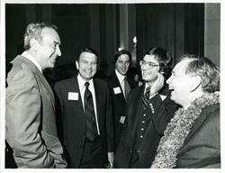 ["Black and white photograph print of Carl Albert with unidentified people at his birthday party, 1976"]