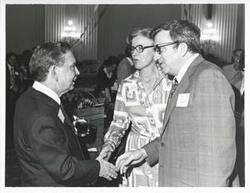 ["Black and white photograph print of Carl Albert with unidentified people at his birthday party, 1976"]