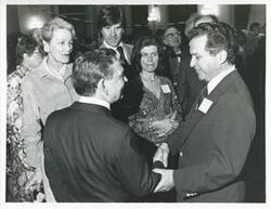 ["Black and white photograph print of Carl Albert with unidentified people at his birthday party, 1976"]